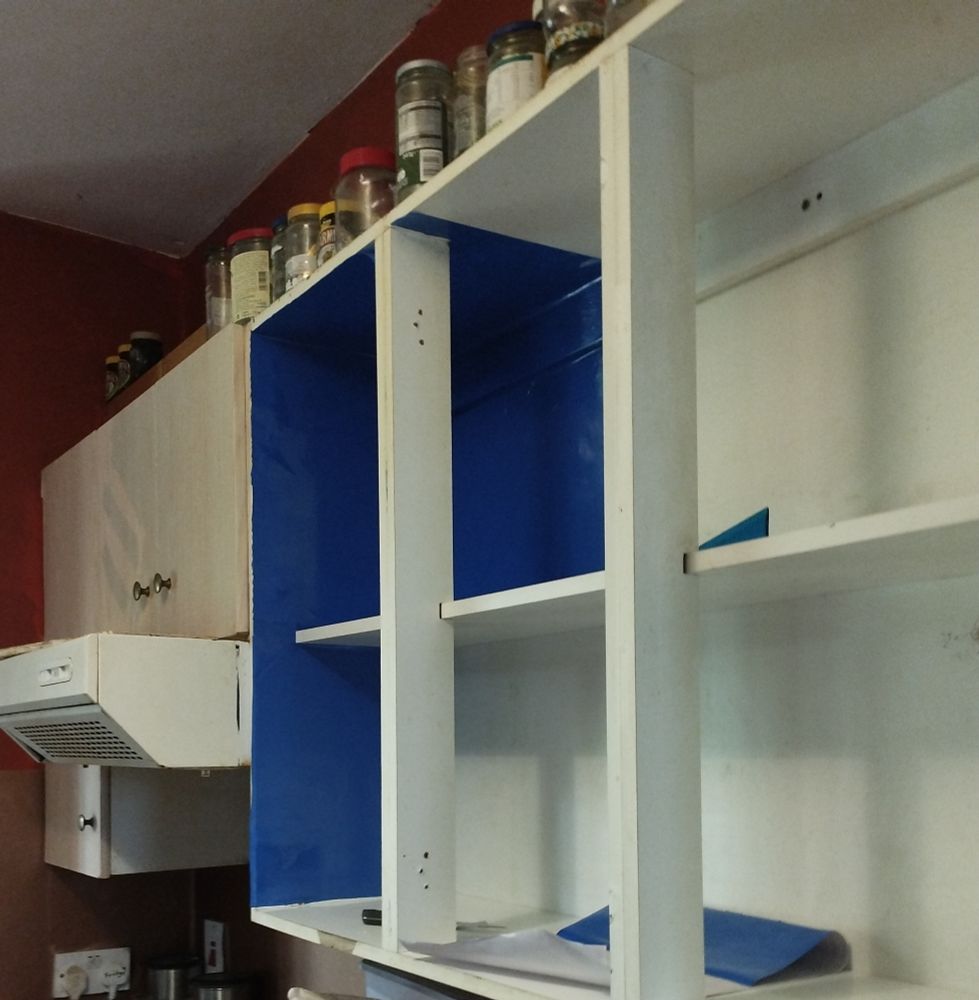 Same bank of overhead cabinets as before, but now, the LHS & first portion of the back have had their blue, sparkly PVC lining fixed in.