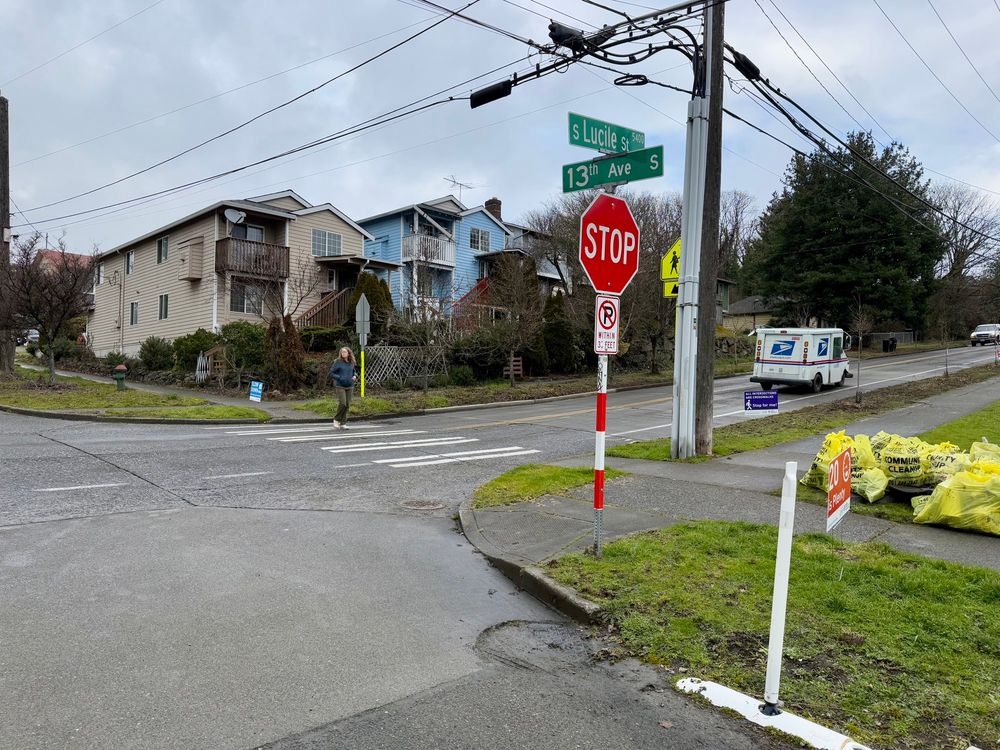 A street crossing on a hillside that has a crosswalk but the curb ramp doesn’t face the crosswalk 