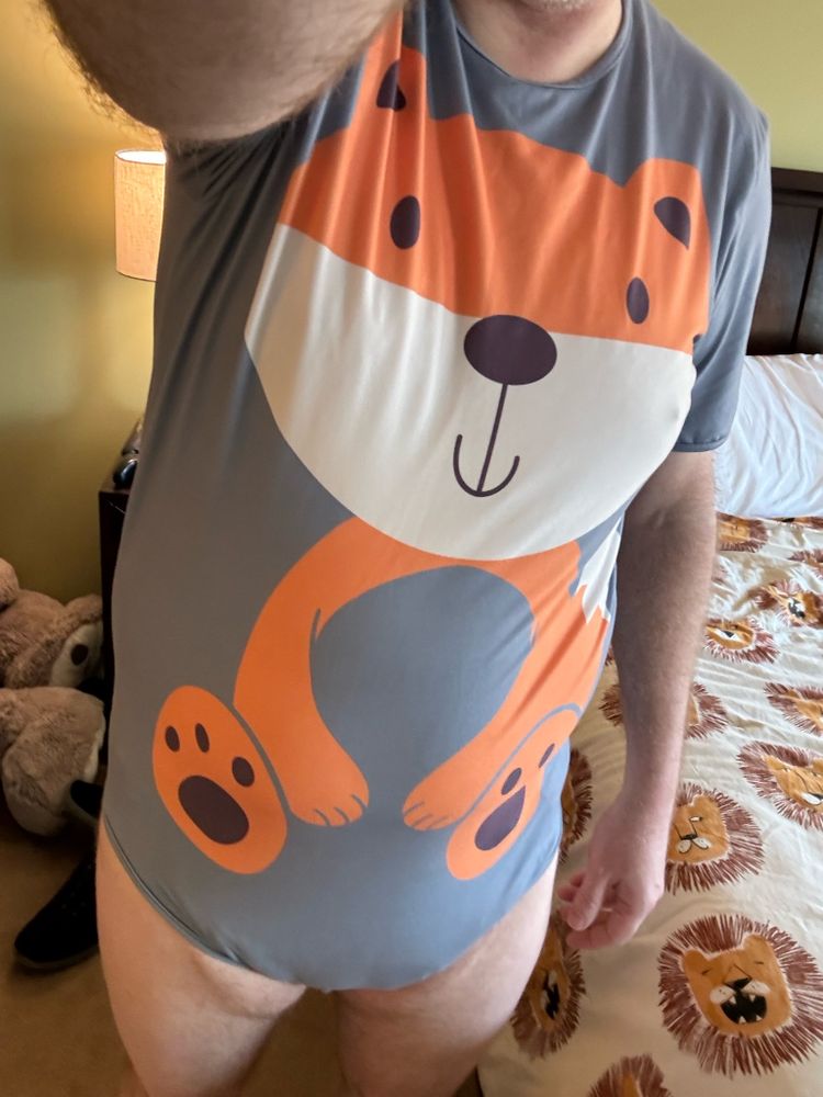 Me in a gray onsie with a bug cartoon fox on it
