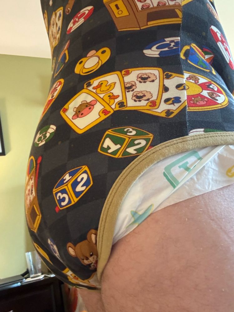 Side view of my rear, covered in an ODU onsie and a Bambino diaper.