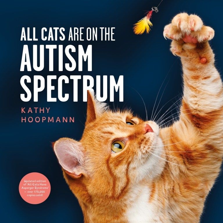 A cover of the book "All Cats are on the Autism Spectrum" by Kathy Hoopman, depicting an orange tabby with a white chest batting at a feather on a string 