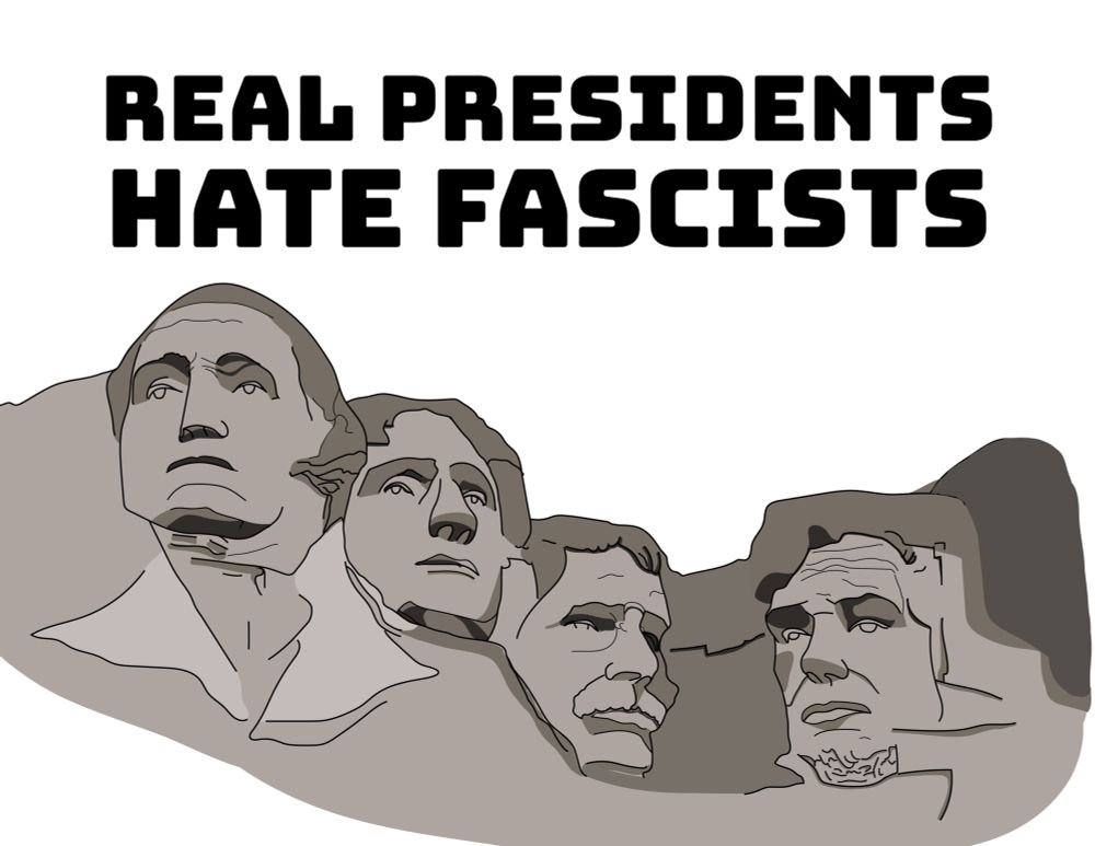 Sign with text: “Real presidents hate fascists” and illustration of Mount Rushmore 