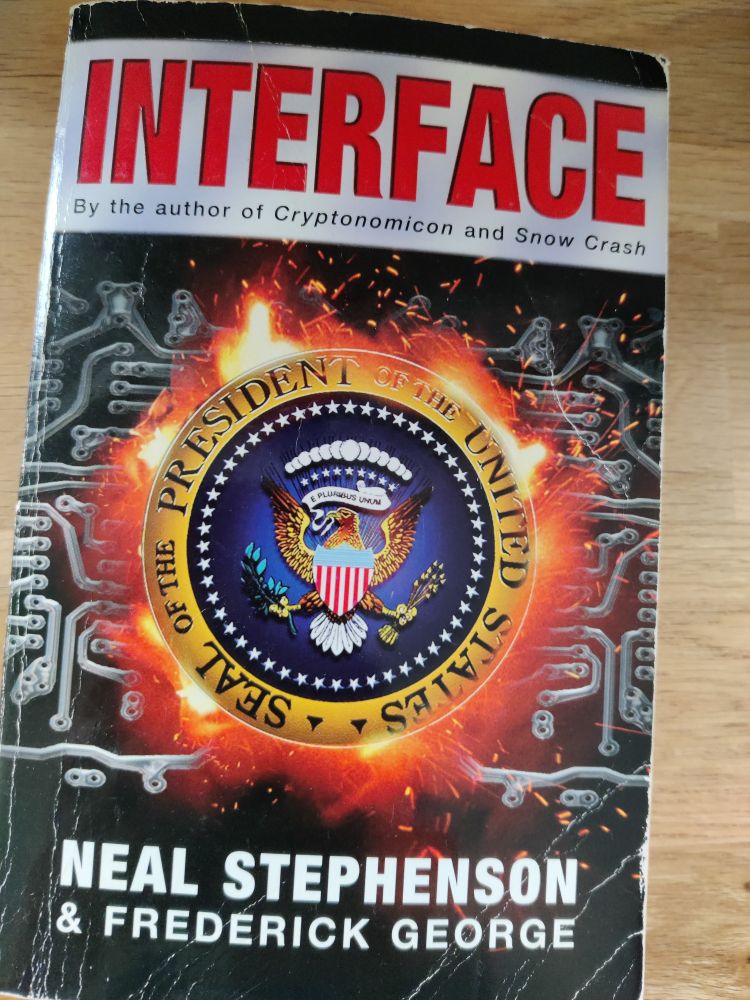 Book cover for Interface 
Seal of the president of the united states burned into  a circuit on a chip