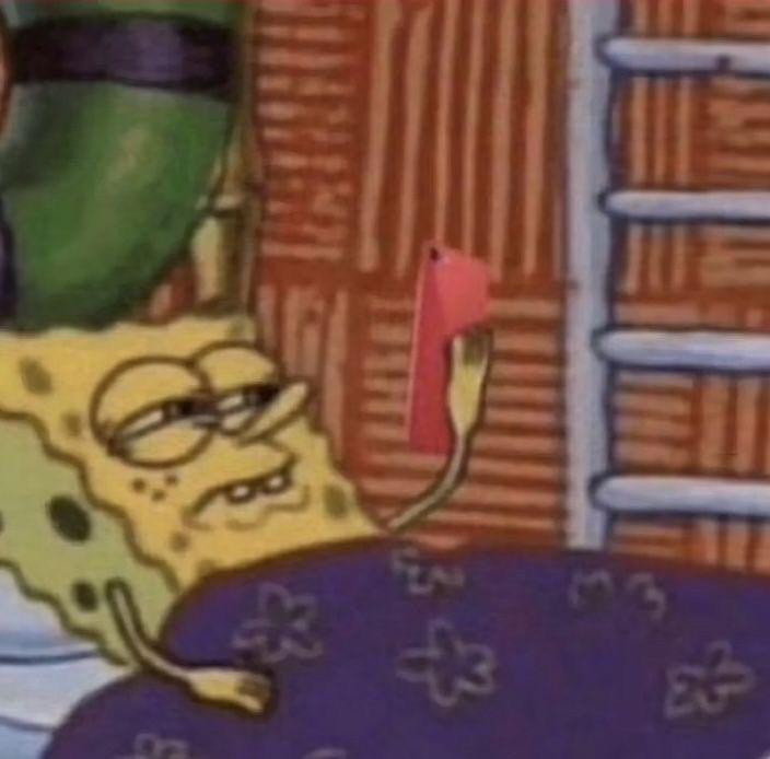 SpongeBob lays in bed squinting at an iPad 