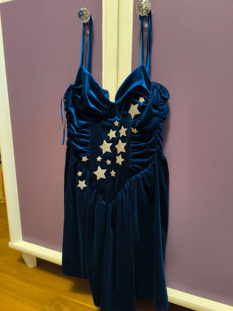A navy blue short dress with silver stars.