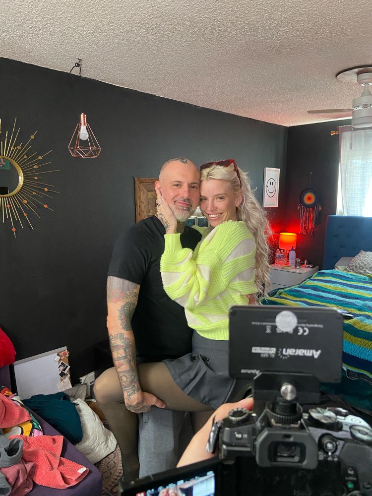 Kitt jones and Tef Wesley posing for a photo together with dahlia Von knight holding the camera. 