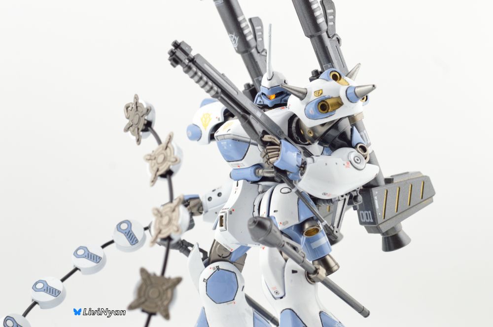 a Picture of the MS-18E kampfer painted in a high gloss white and pale blue with Metallic gold and gunmetal accents