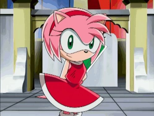 amy rose from sonic the hedgehog is wearing a red and white dress