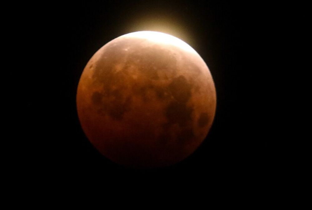 Image of blood red moon during lunar eclipse.
photo credit: APNews, https://apnews.com/article/total-lunar-eclipse-blood-moon-97632bddb4896656b3adb7fd6d818562 
