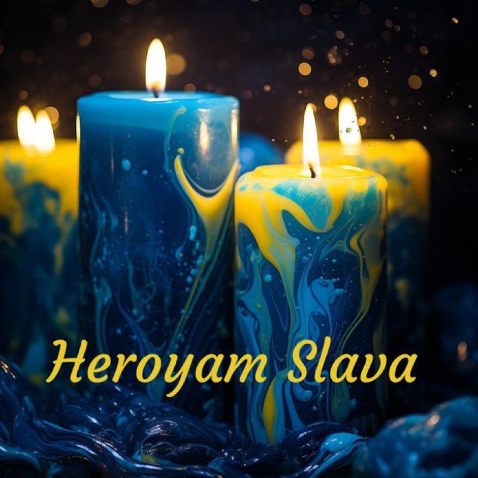 Blue and yellow candles with written "Heroyam Slava"