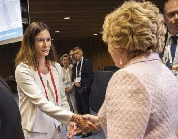 Maja Riniker give her hand to Valentina Matvinienko, russian propagandist  