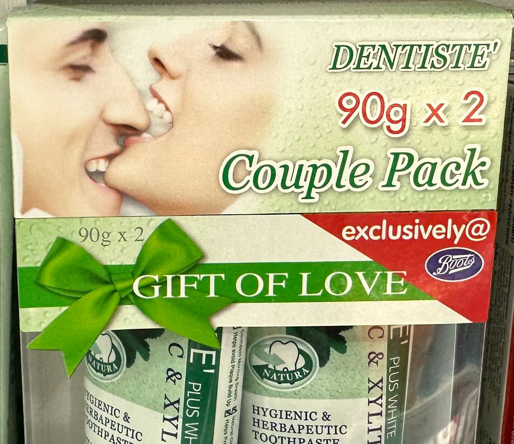 A package containing toothpaste “for couples”? There’s a close up photo of an ecstatic couple, the man biting down on the woman’s chin as she simultaneously bites his nose