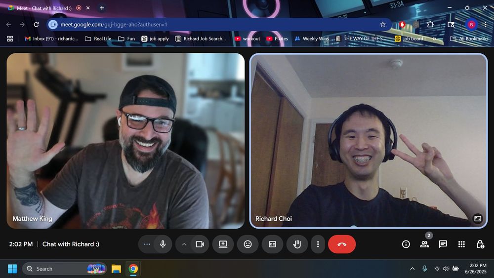 Google meet video split screen matthew on the left with right hand raised palm facing the camera, richard on the right with right hand posing peace sign