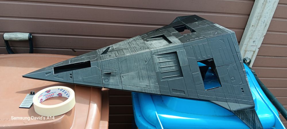 The bottom of the ship, lots of details including two large rectangular vents for scooping hydrogen for fuel. Two smaller winglets near the nose are for atmospheric maneuvering.

There are three rectangular holes (nose and near either wing) for the landing gear (not yet assembled).

Still no banana to be seen.