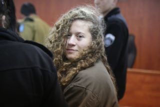 The iconic image of Tamimi as the acceptable face of Palestinian resistance in Western eyes. 