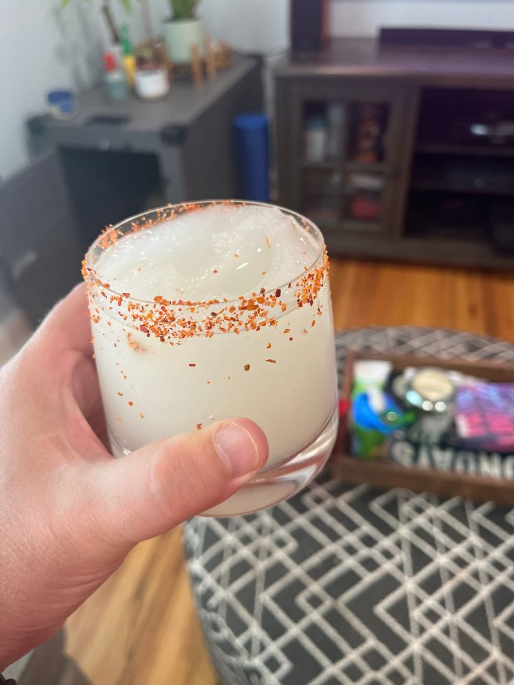 Frozen margarita with a tajin rim 