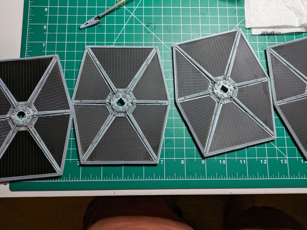 The TIE Fighter wing panels with the tape removed, revealing flat black interior untouched by gray airbrushing