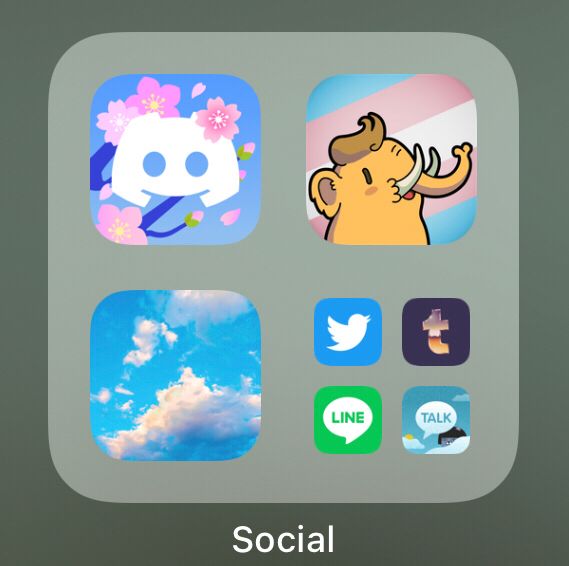The social app folder in the app gallery on iOS, displayed are discord (the cherry blossoms icon), toot! (the trans flag icon) and bluesky (blue sky with clouds). Smaller are Twitter (still blue with a bird, not updated!), Tumblr (the current icon is the purple one with the pink-gold metallic t), line (green) and KakaoTalk (the blue sky with clouds icon).

Yes, I do massage the list by turning some off in search!