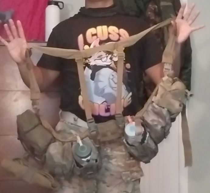 Potato Tea holding up a belt with equipment attached to it.