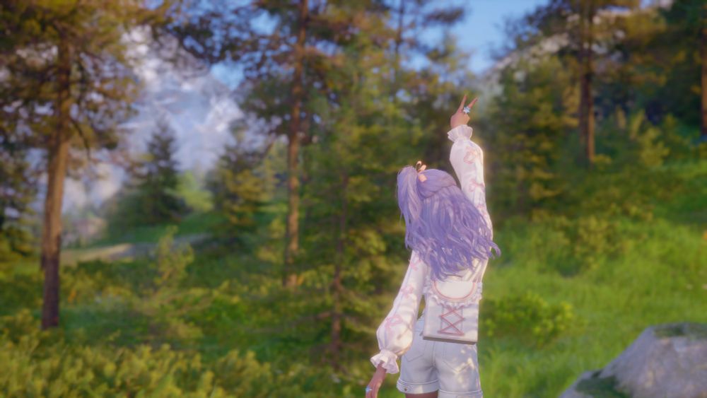 Nikki making a 'v' peace sign while surrounded by forestry. 