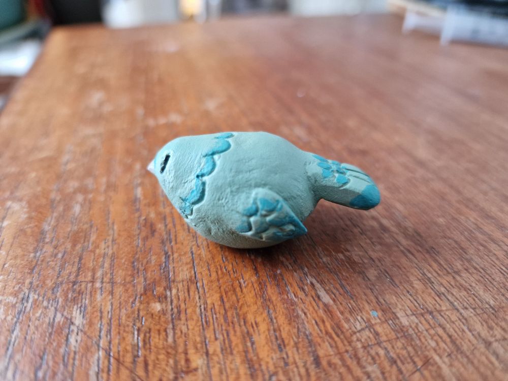 Very small green pigeon ornament