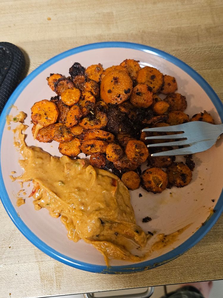 Roasted carrots with 3 pepper hummus. The carrots were marinated with a seasoning of pepper, lemon pepper, crushed red pepper, garlic powder, onion powder, an Italian seasoning blended, and a little salt. That was all mixed with olive oil and some soy sauce to make it easier to coat then roasted for 20 minutes at 350 with a 30 second broil... It's good.