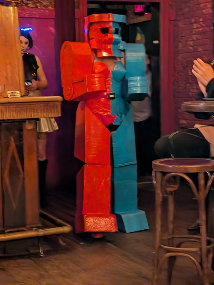 Lola Minx in the full Rock Em Sock Em Robot costume walking into Bar Lubitsch 