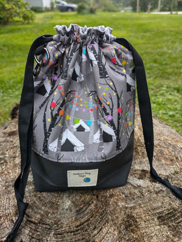 Drawstring top project bag in print featuring yurts and rainbow string lights.