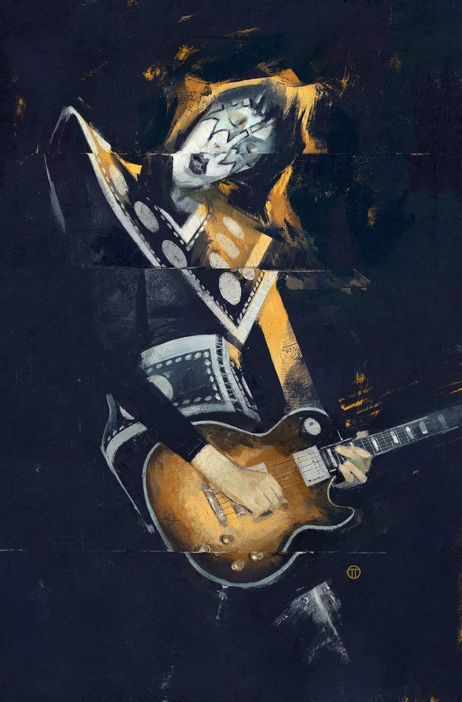Ace Frehley of KISS playing guitar.