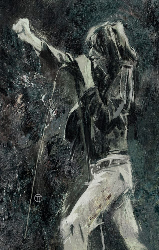 Joey Ramone on stage right fist out and left hand pulling mic to mouth. 