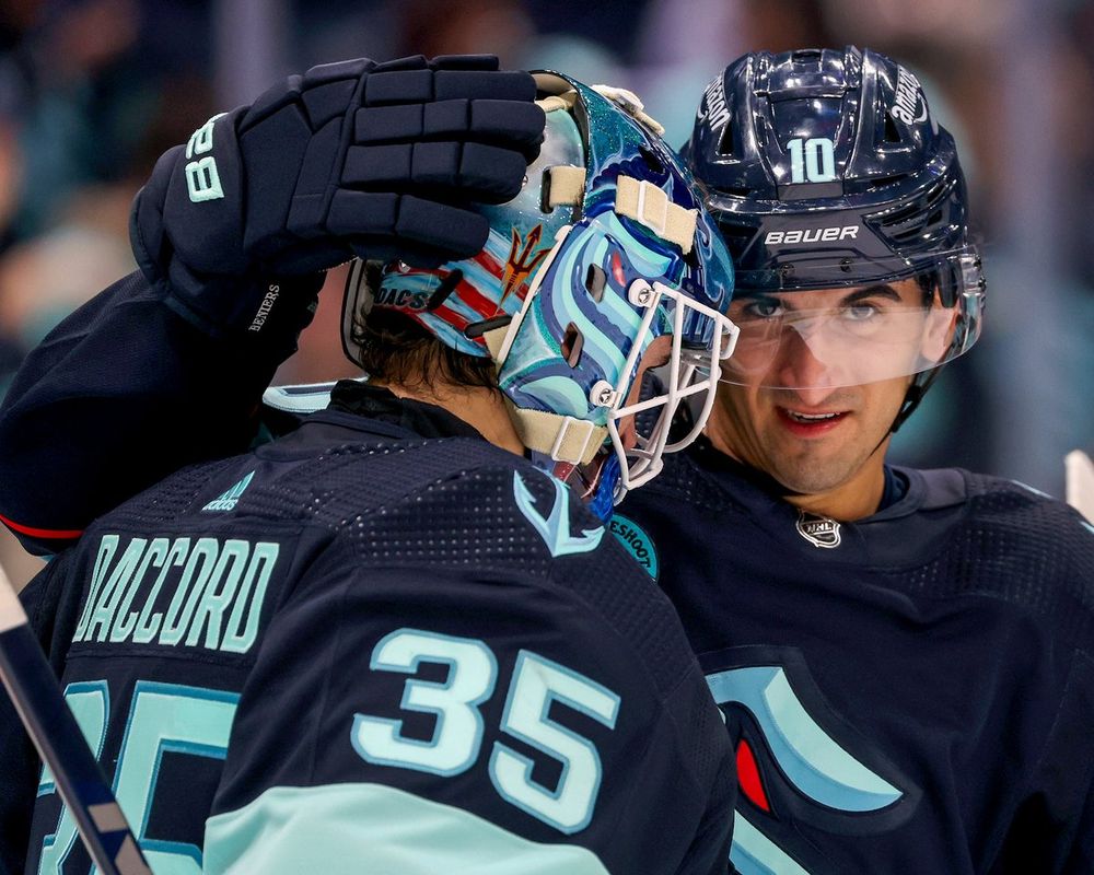 Close up of Matty giving Joey his goalie hug.