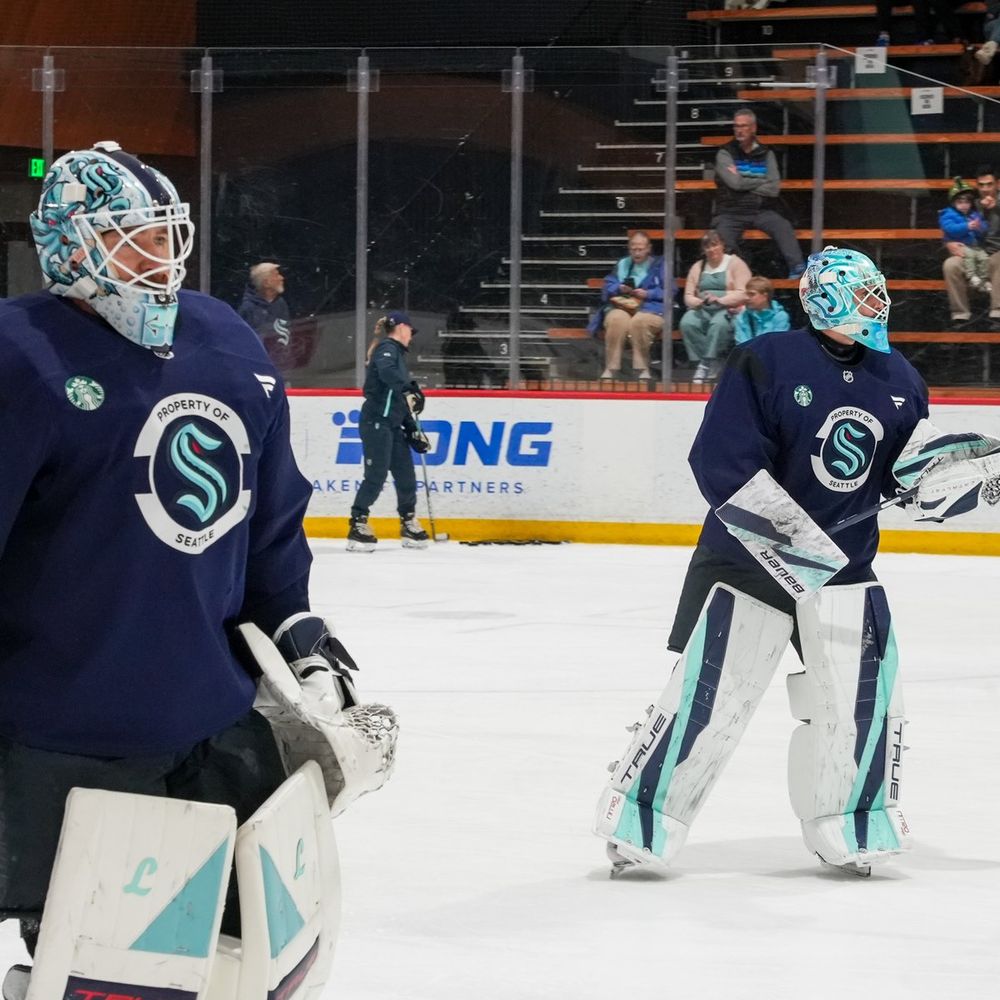 Photo of Murray and Joey skating during practice.