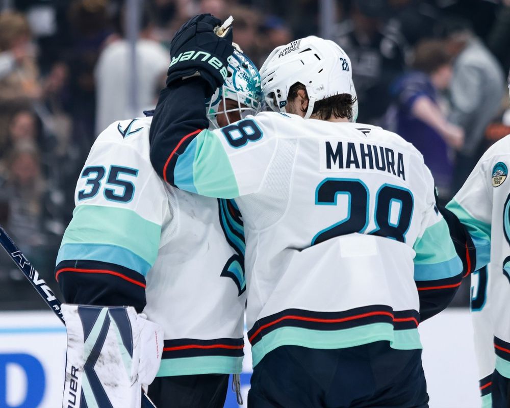 Photo of Joey and Mahura hugging after win over Kings.