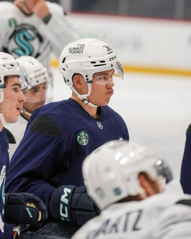 Photo of Jani listening to instructions during practice.