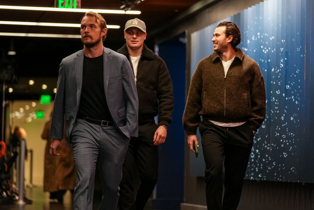 a photo of Seattle Kraken defenseman Ryan Lindgren and Josh Mahura, along with forward Kaapo Kakko, walking into tonight's game.