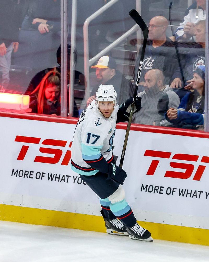 a photo of Seattle Kraken forward Jaden Schwartz celebrating his goal.