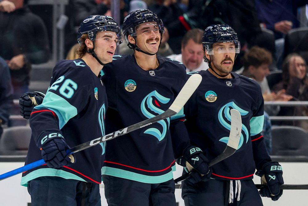 Photo of (From L-R) Winterton, Mush and Stevi celebrating a goal.