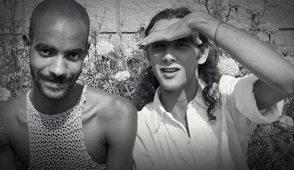 Paul and his partner Guy. Guy is wearing a really fantastic crochet tanktop. Black and white photo.