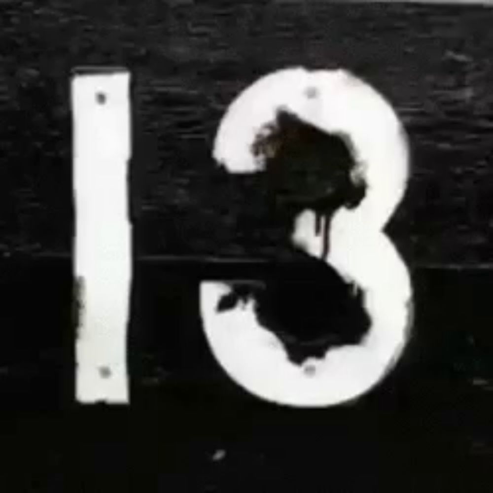 a red wall with the number 13 on it