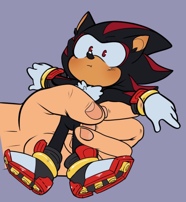 that same chibi shadow the hedgehog being held tightly in a fist