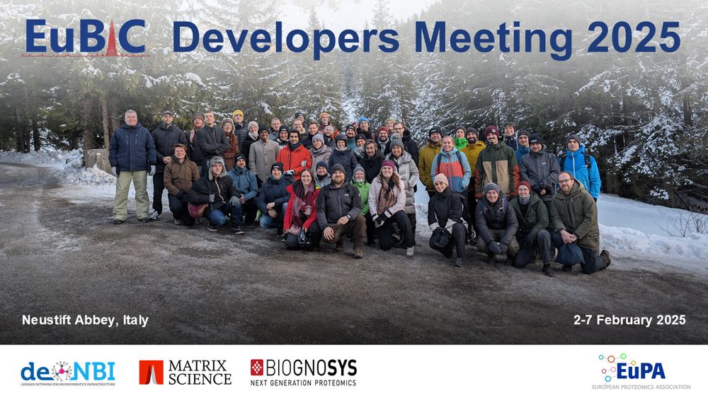 Group picture of all EuBIC2025 participants in front of snowy pine trees. Captioned "EuBIC-MS Developers Meeting 2025, Neustift Abbey, Italy, 2-7 February 2025, Sponsors: de.NBI, Matrix Science, and Biognosys. Powered by EuPA"