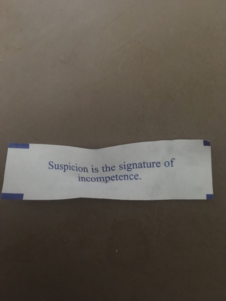 A fortune cookie fortune that says “Suspicion is the signature of incompetence.”