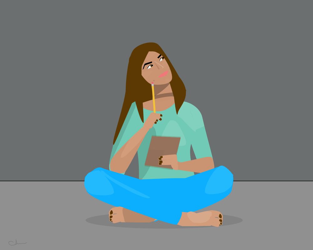 A young woman sits cross-legged on the floor, holding a small notepad in one hand and a yellow pencil in the other. She’s looking up in thought with a soft smile, like she’s daydreaming or planning something important. She wears a loose mint-green top and bright blue pants, with long brown hair falling over one shoulder. The background is a simple gray wall and floor, giving her a cozy, focused vibe.