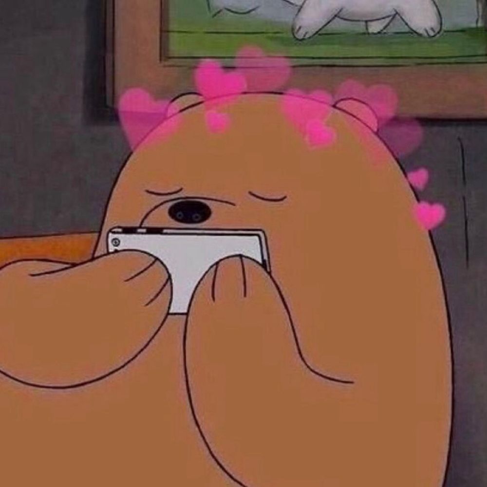 reaction image of grizzly from we bare bears kissing his phone screen with hearts around his head.