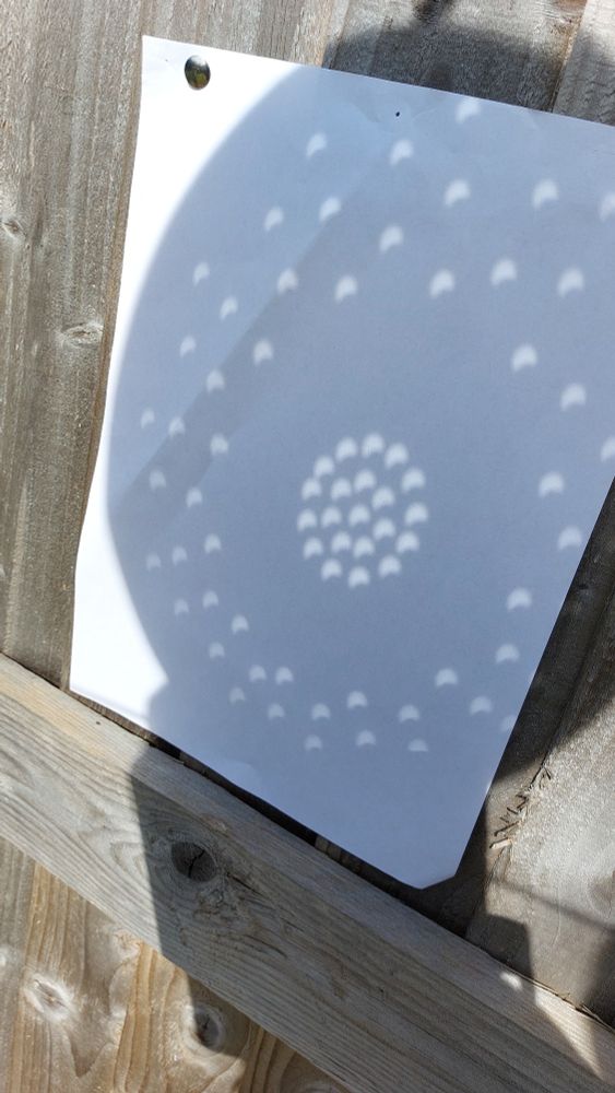 Colander shadow showing 30% partial solar eclipse