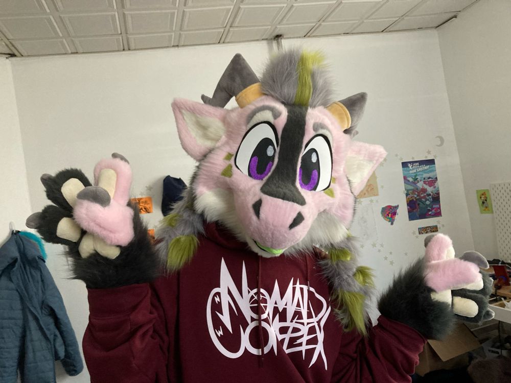 Photo of a pink toony dragon partial fursuit 
