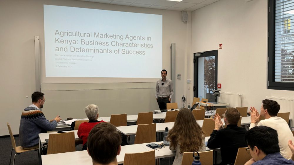Dr. Michael Keenan giving a presentation on "Agricultural Marketing Agents in Kenya: Business Characteristics and Determinants of Succes" at the DPE Seminar.