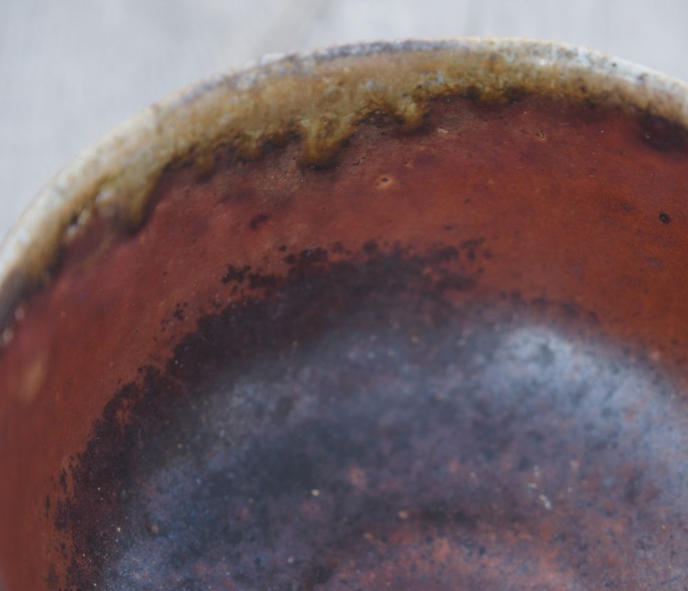 Rim and interior of chawan showing ash deposits. 