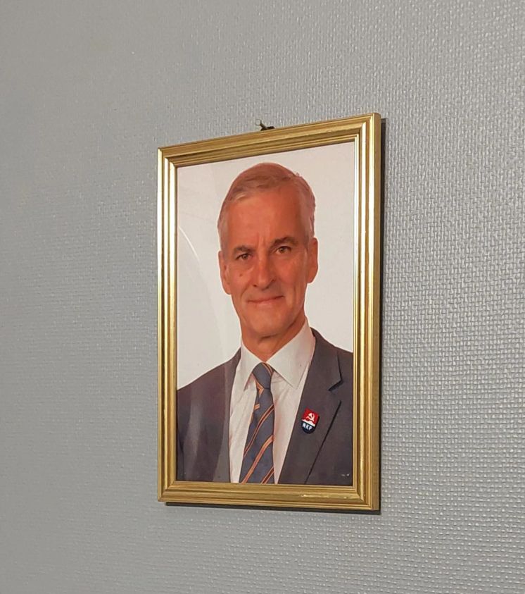 Portrait on wall of Prime Minister of Norway, Jonas Gahr Støre with a Norwegian Communist Party pin edited on.