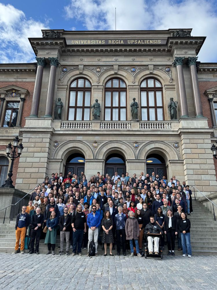 A group photo of people in front of a building